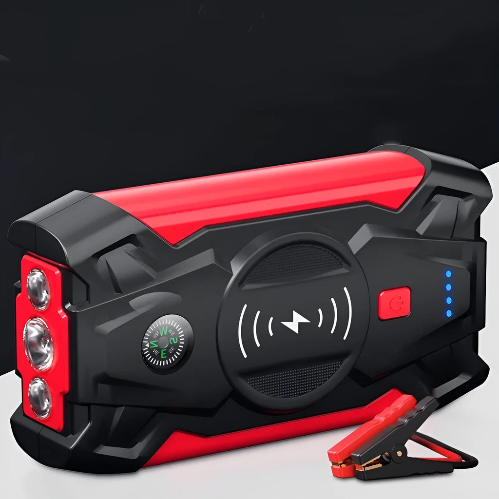 Red 12V car battery jump starter power pack with battery clips on a black background.