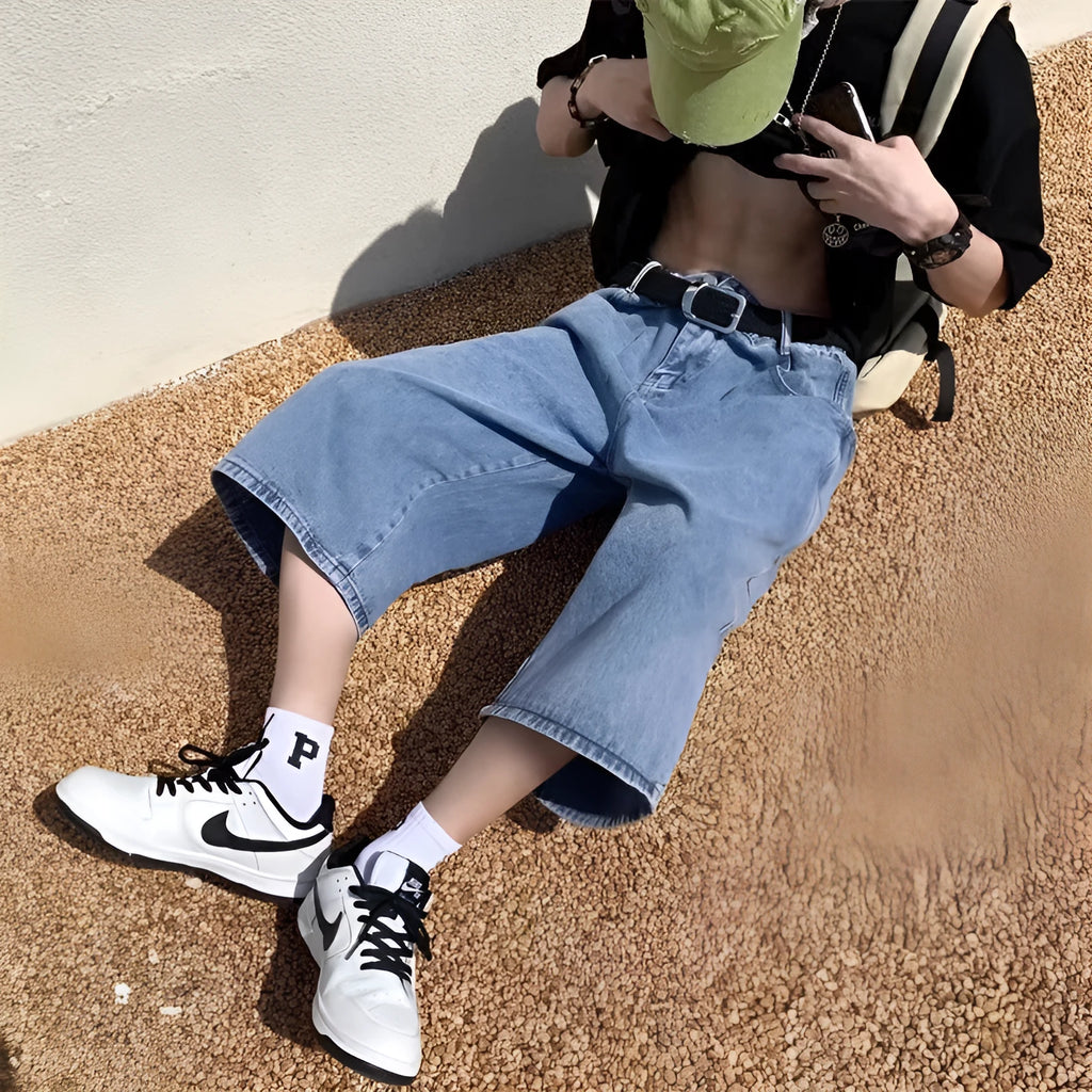Men's blue washed denim pirate shorts with a cropped length, high waist, and straight leg.