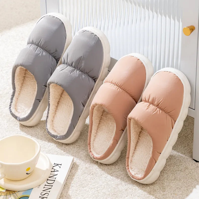 A pair of down cotton indoor slippers with a thick rubber sole and plush lining, shown in a choice of colours.