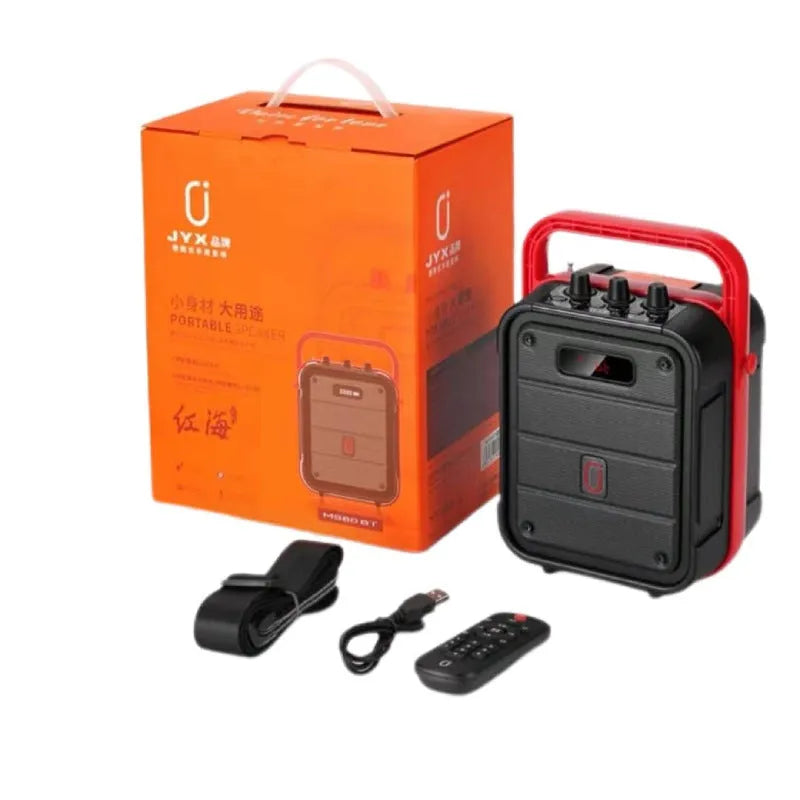 MS62AI black portable Bluetooth speaker with wireless microphone and remote control on a table.