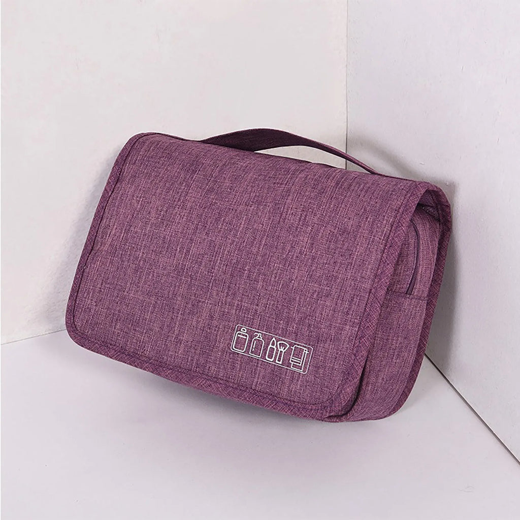 Large waterproof hanging toiletry bag in black with four compartments and metal hook