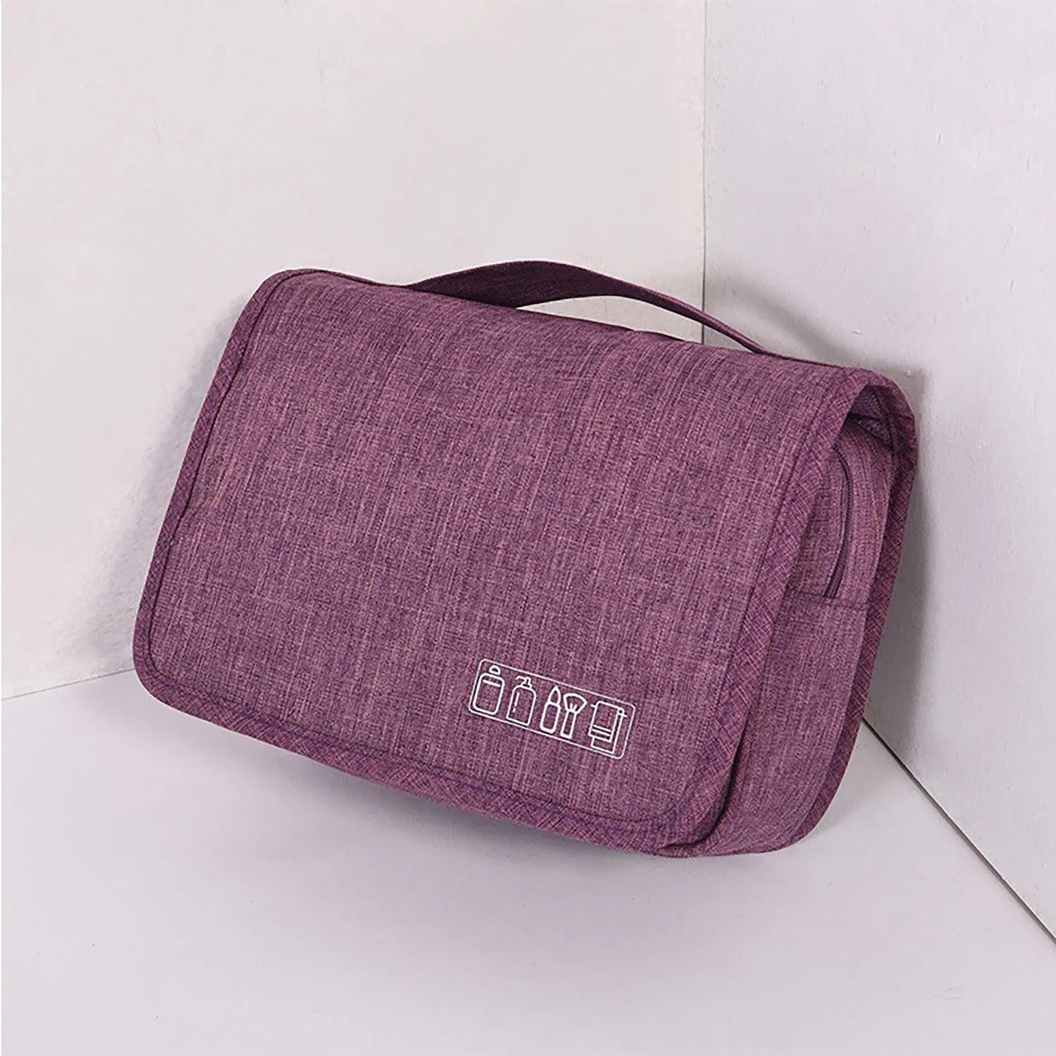 Large waterproof hanging toiletry bag in black with four compartments and metal hook