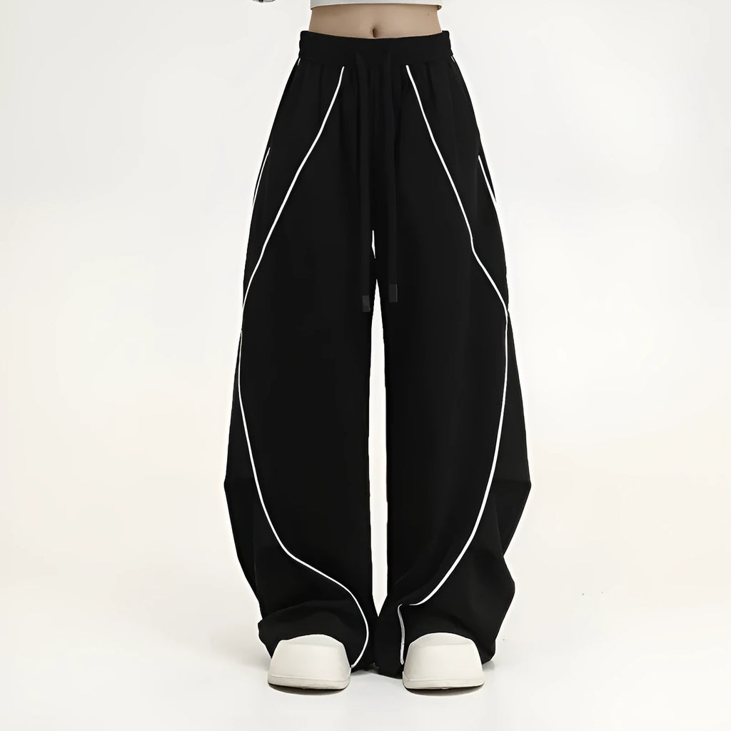 Black pleated wide-leg hip hop sports trousers with striped pattern on a mid waist.