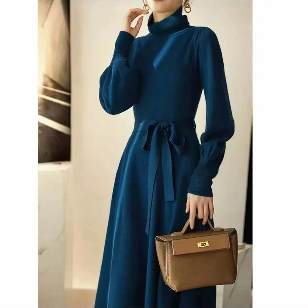 Rose red turtleneck knitted polyester dress with long sleeves, elastic waist, and a loose mid-length skirt hem.