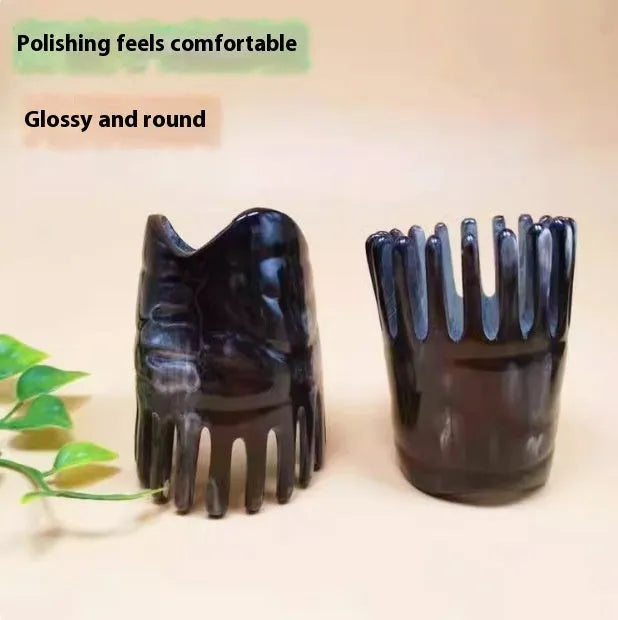 Black buffalo horn comb with wide teeth and a pointed long tip for hair and scalp massage.