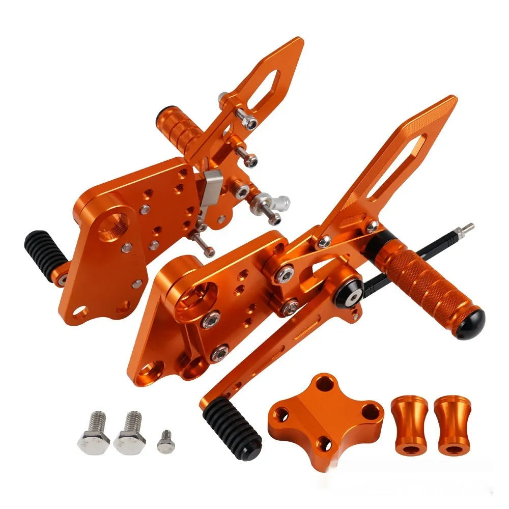 KTM DUKE motorcycle rear pedal support assembly bracket kit in black or orange