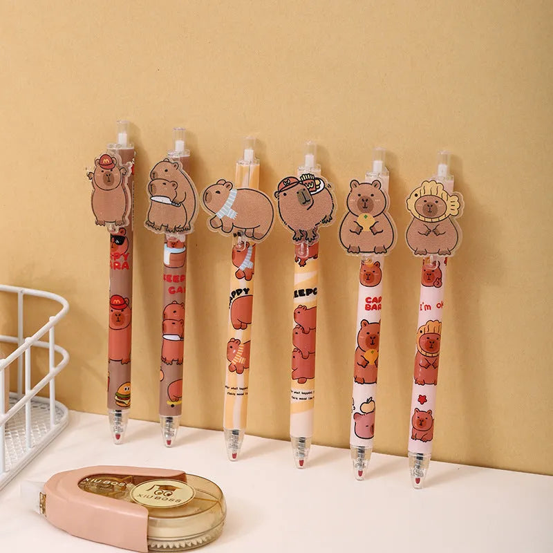 Open box showing 48 cartoon bear themed plastic gel pens with press barrels.