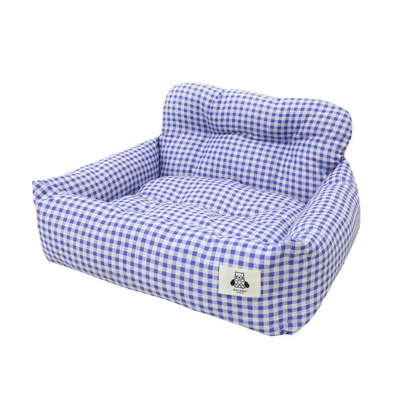 Grey and blue plaid cloth car-mounted pet nest bed for small dog travel.