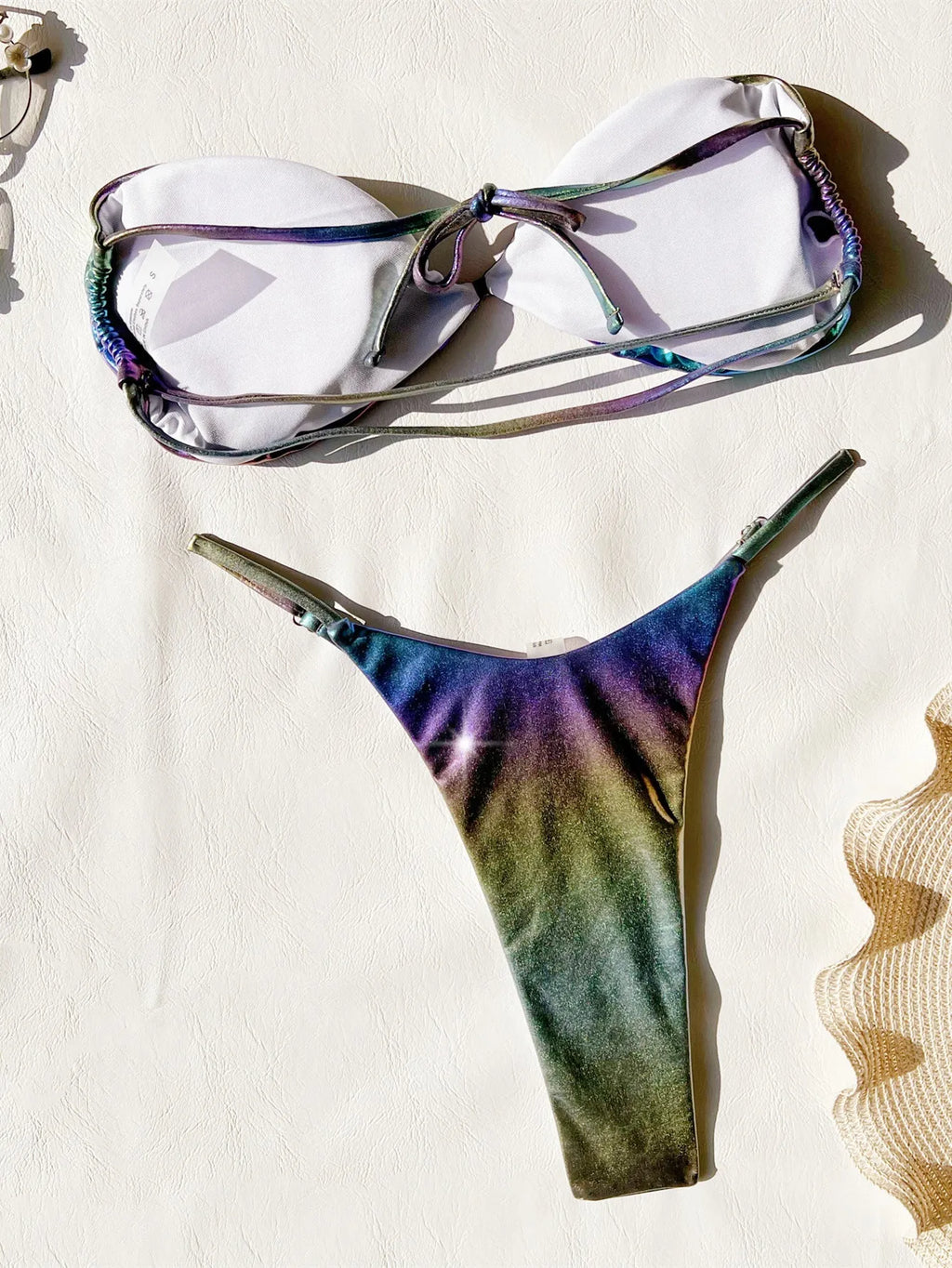 Women's purple gradient bikini swimsuit on a mannequin, showing front and back views.