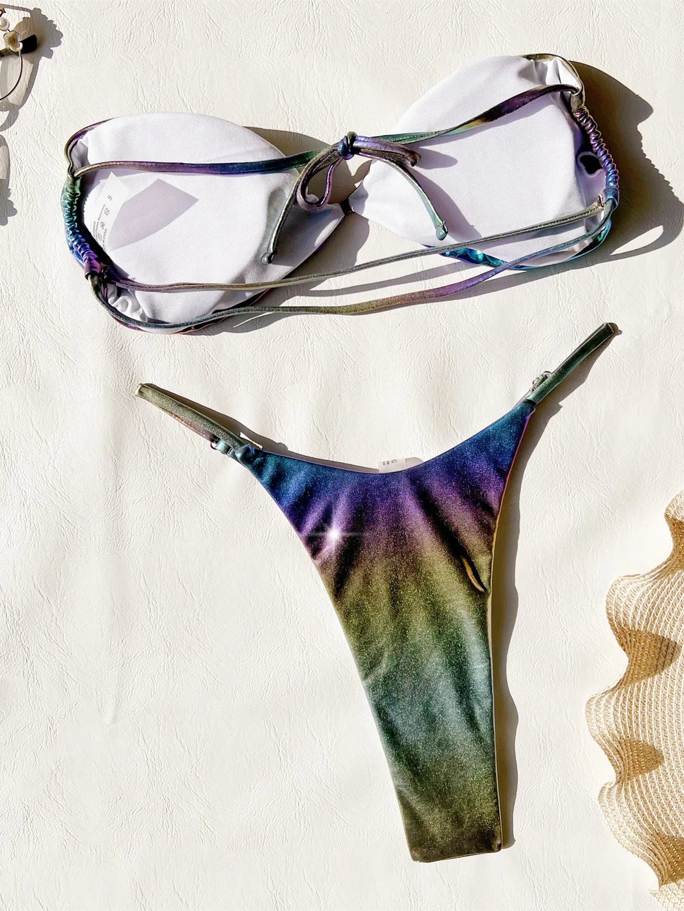 Women's purple gradient bikini swimsuit on a mannequin, showing front and back views.