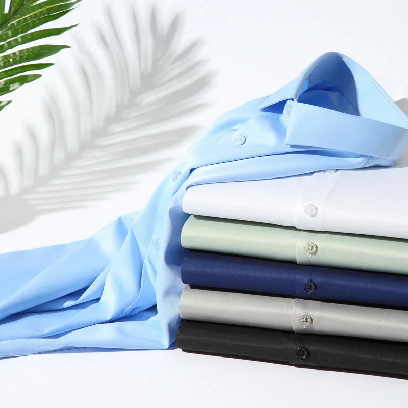 Men's loose fit long-sleeved non-ironing shirt in a solid colour, made from breathable polyester spandex fabric.