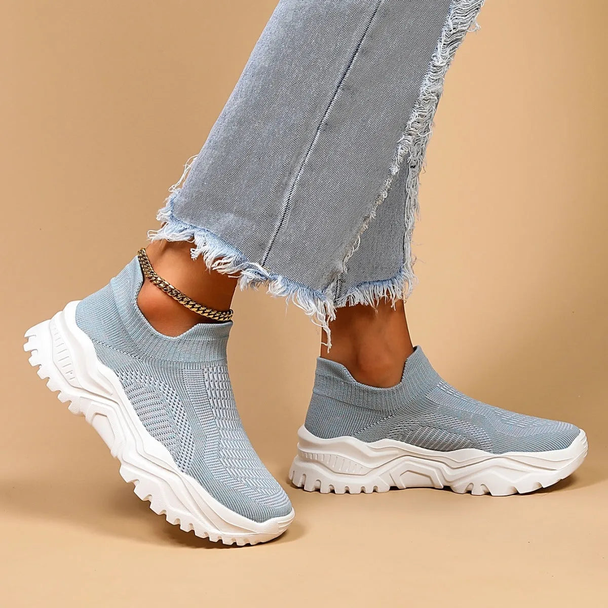 Women's light blue mesh slip-on sports shoes with round toe and mid heel