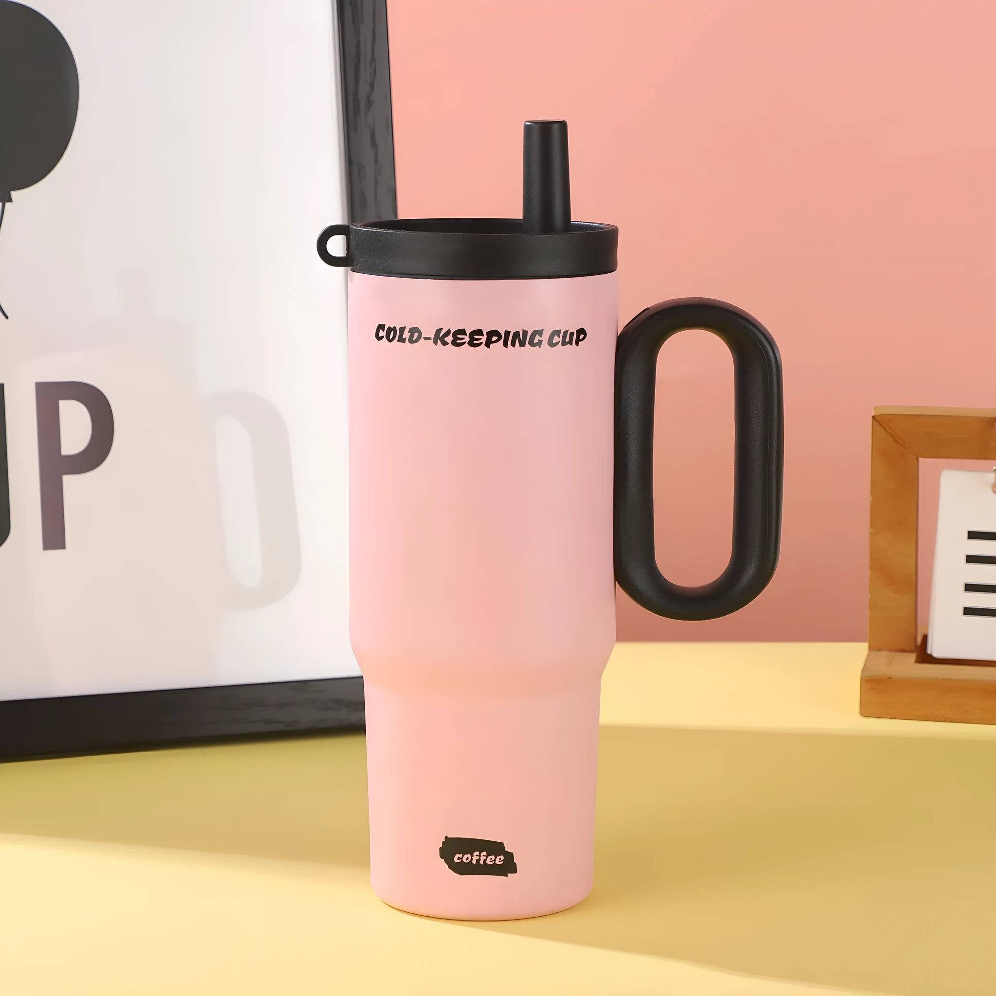 Large insulated plastic straw cup with a carry handle in a choice of five colours.