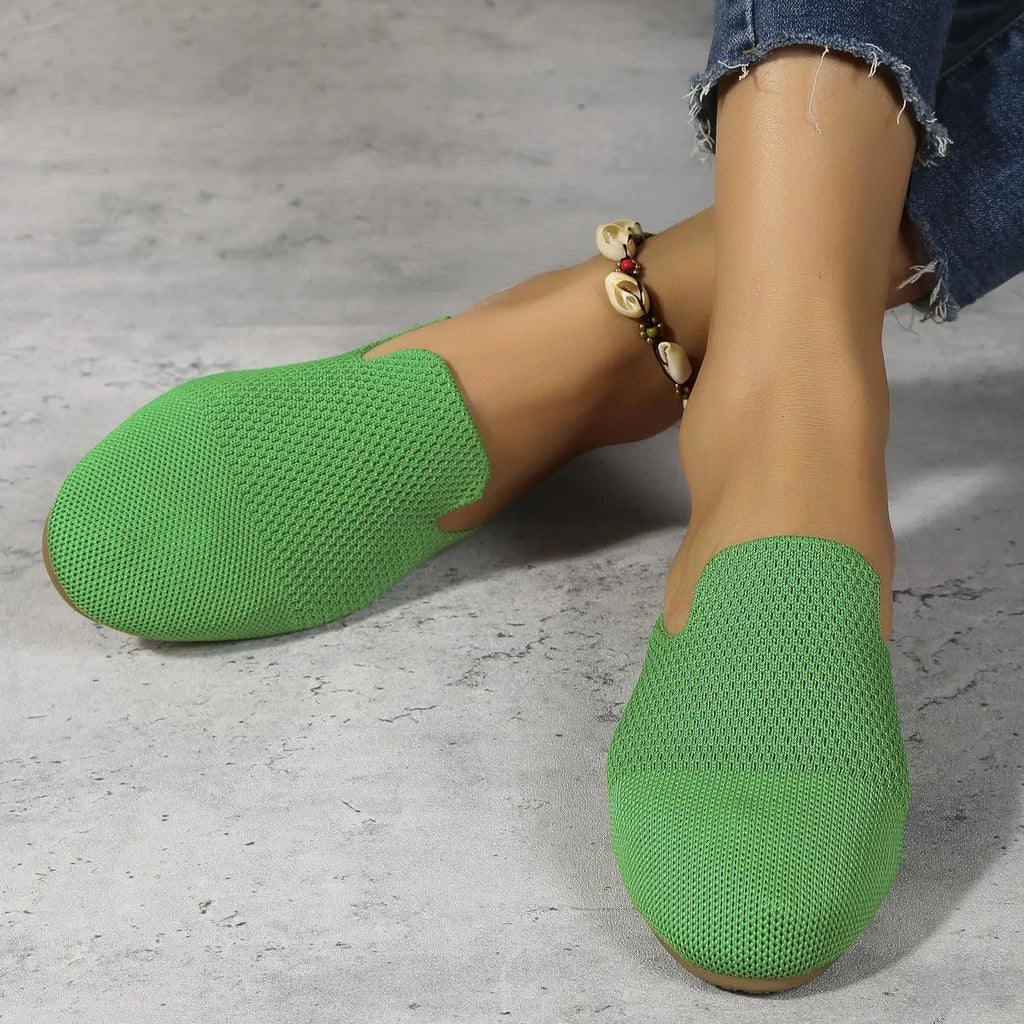 Mesh sandals with cloth upper and rubber sole in apricot colour, showing round toe slip-on design