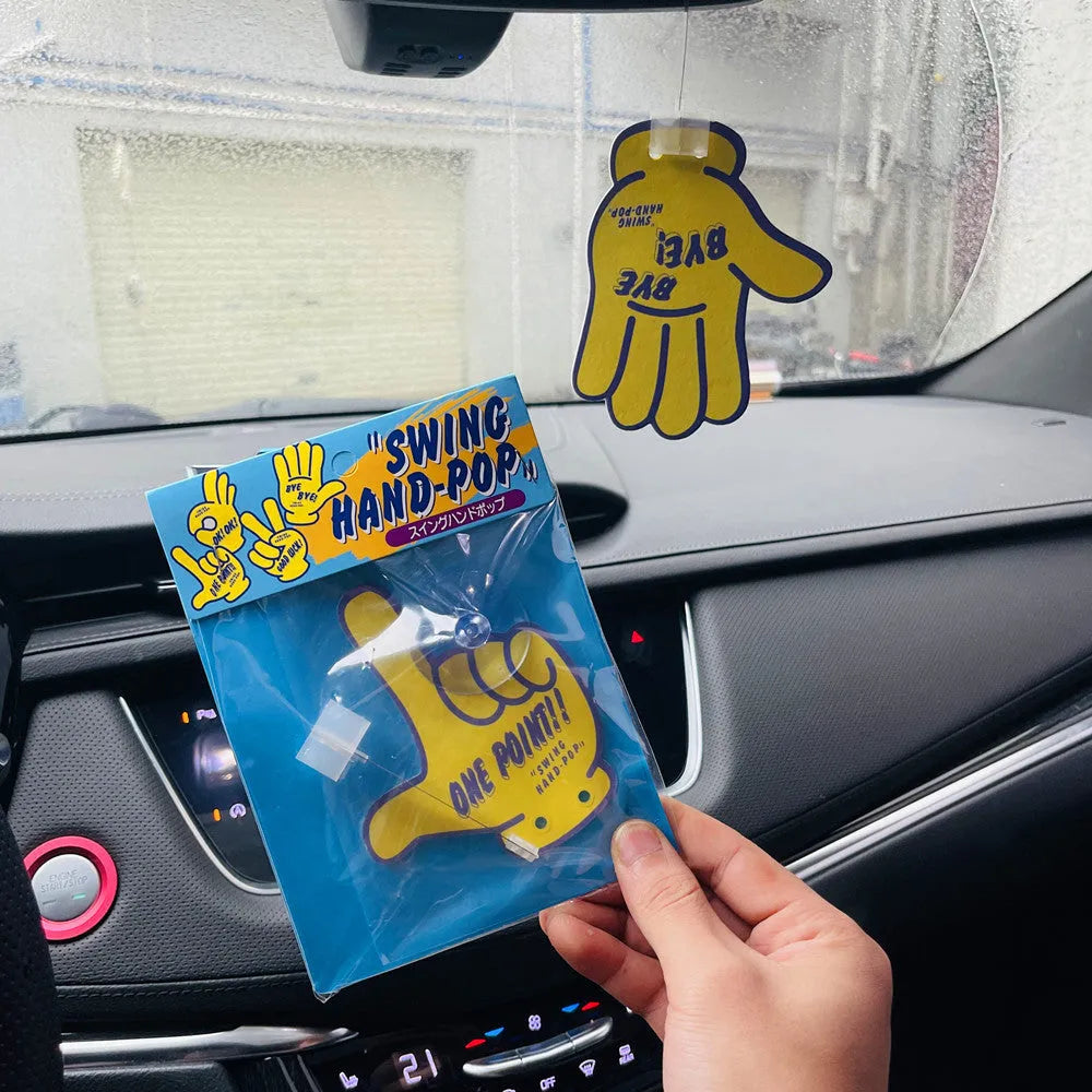Cartoon swing hand aromatherapy pendant with jasmine green tea scent on its fixed mounting bracket.