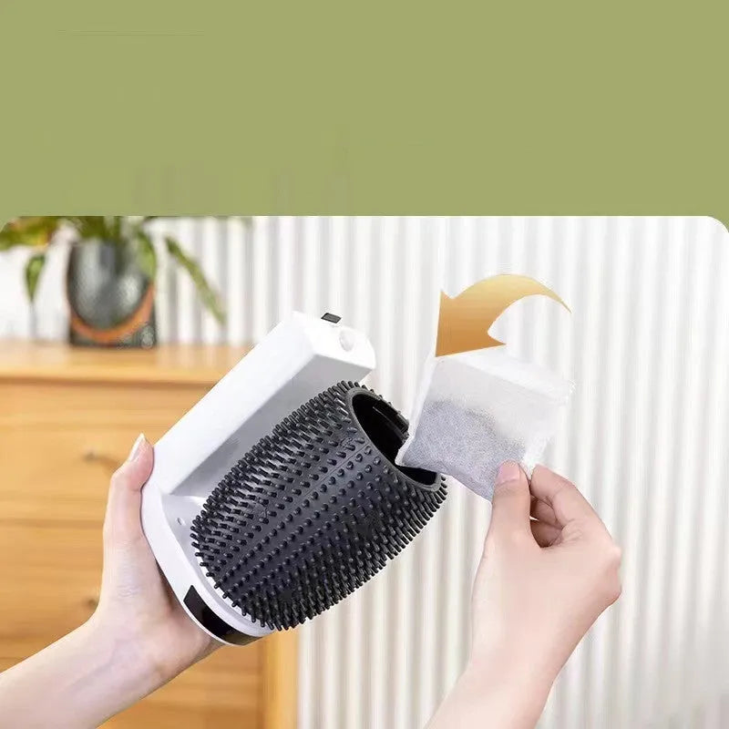 White automatic cat self-groomer with silicone bristles mounted in a corner.