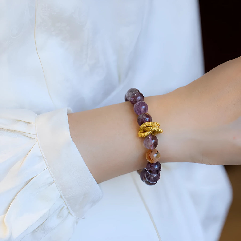Purple cornucopia bracelet with nine purple crystals and zodiac animal design