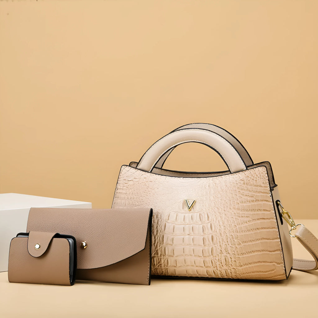 Women's square black crocodile pattern crossbody handbag with visible stitching and a single shoulder strap.