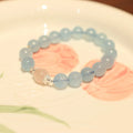 Chinese style aquamarine bead bracelet with a Fengjiu fox charm and crystal accents.