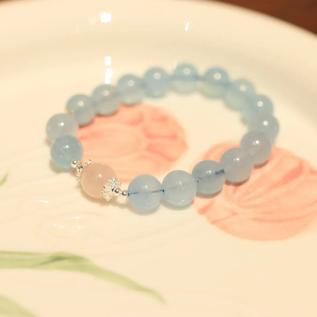 Chinese style aquamarine bead bracelet with a Fengjiu fox charm and crystal accents.