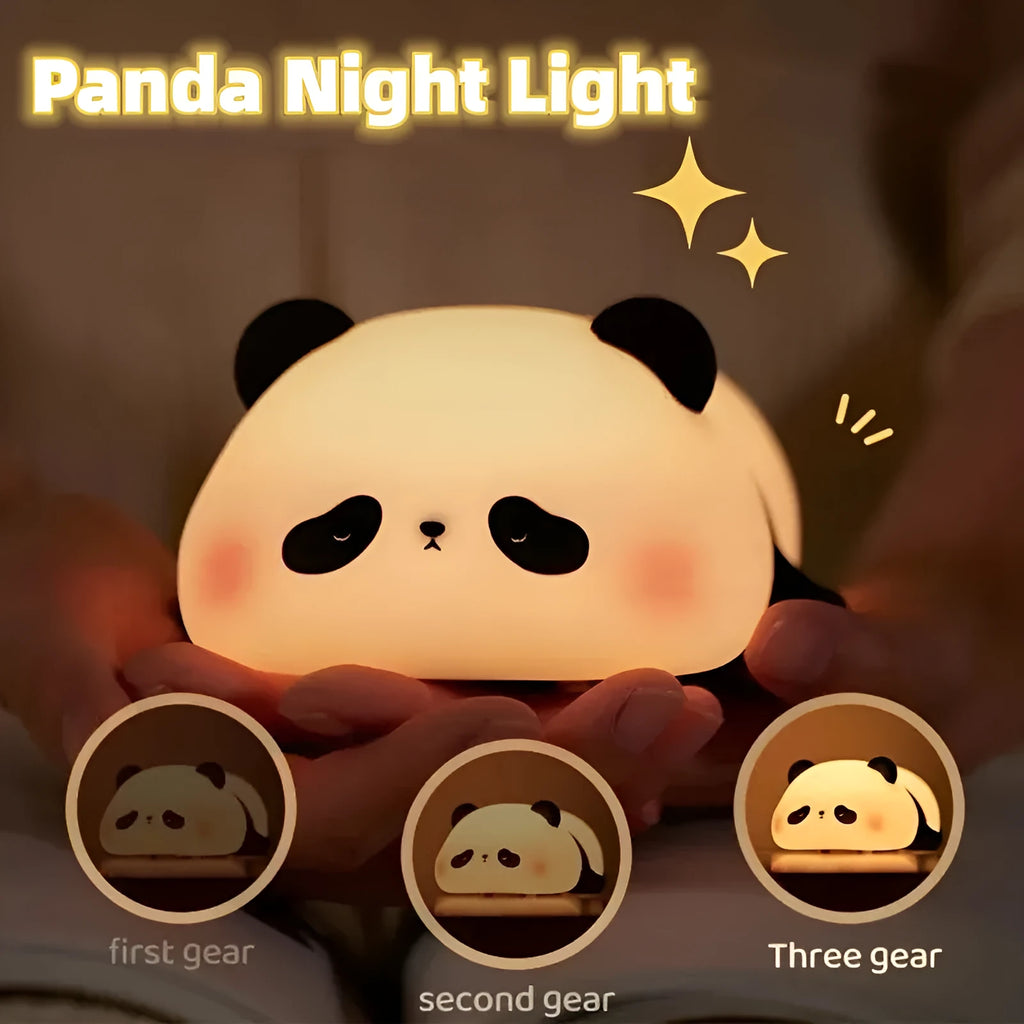 Cartoon panda silicone night light with USB charging cable on wooden surface