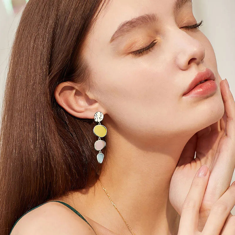 Morandi three-colour oil drip finish on disc-shaped alloy earrings with sterling silver post.