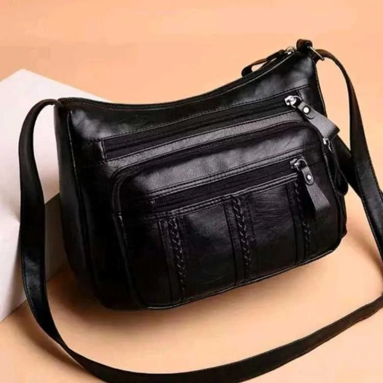 Black soft PU leather messenger bag with retro stitching and single shoulder strap