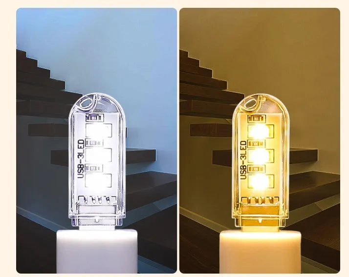Small round white USB LED night light for nursery or bedroom on a dark surface.