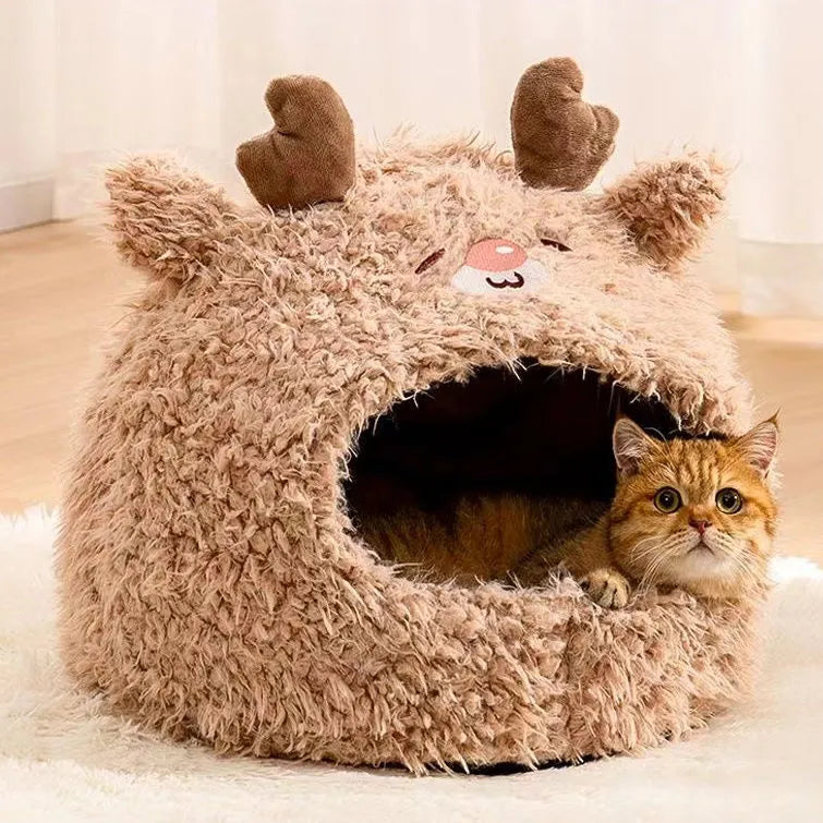 Semi-enclosed yurt-style cat litter tent in an animal print, shown next to a litter tray.