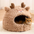 Semi-enclosed yurt-style cat litter tent in an animal print, shown next to a litter tray.