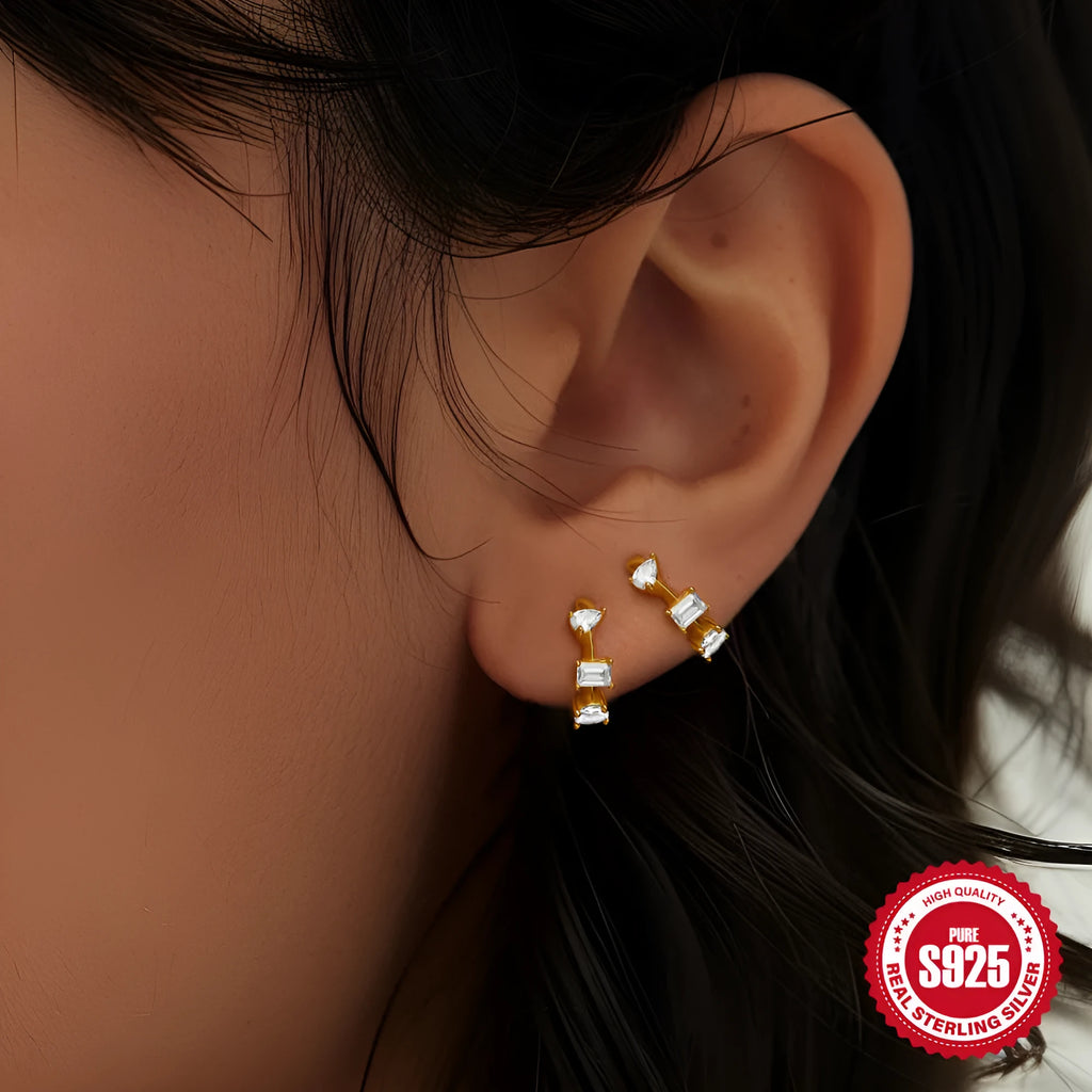 Small round sterling silver geometric stud earrings with a circle design in a gold or silver finish.