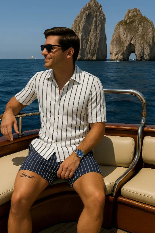 Man wearing a light-coloured elastic beach shirt and matching shorts set for summer.