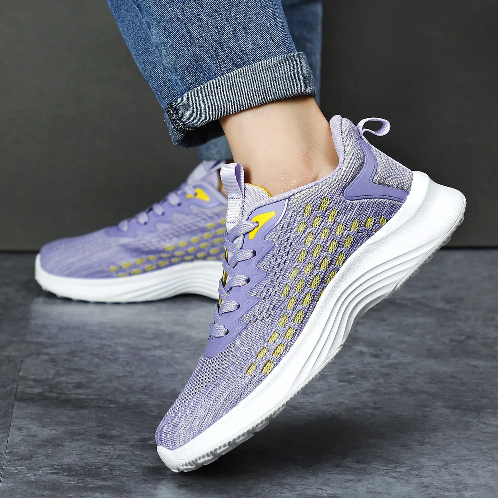 Women's lavender purple Flyknit running shoes with mesh upper and EVA sole on a white background.