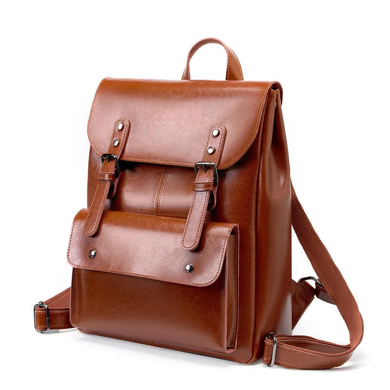 Black cowhide leather laptop backpack for women with a structured, hard-sided design.