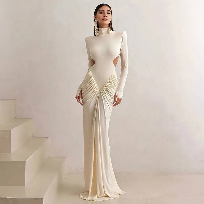 A woman's long sleeve high collar slim fit pleated backless formal dress in a solid colour.