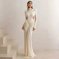 A woman's long sleeve high collar slim fit pleated backless formal dress in a solid colour.