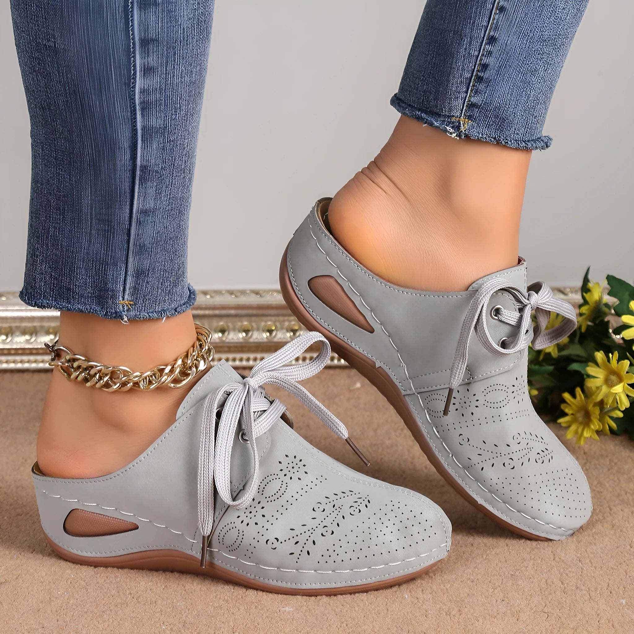 Women's black suede lace-up wedge sandals with a hollow-out design and rubber sole.