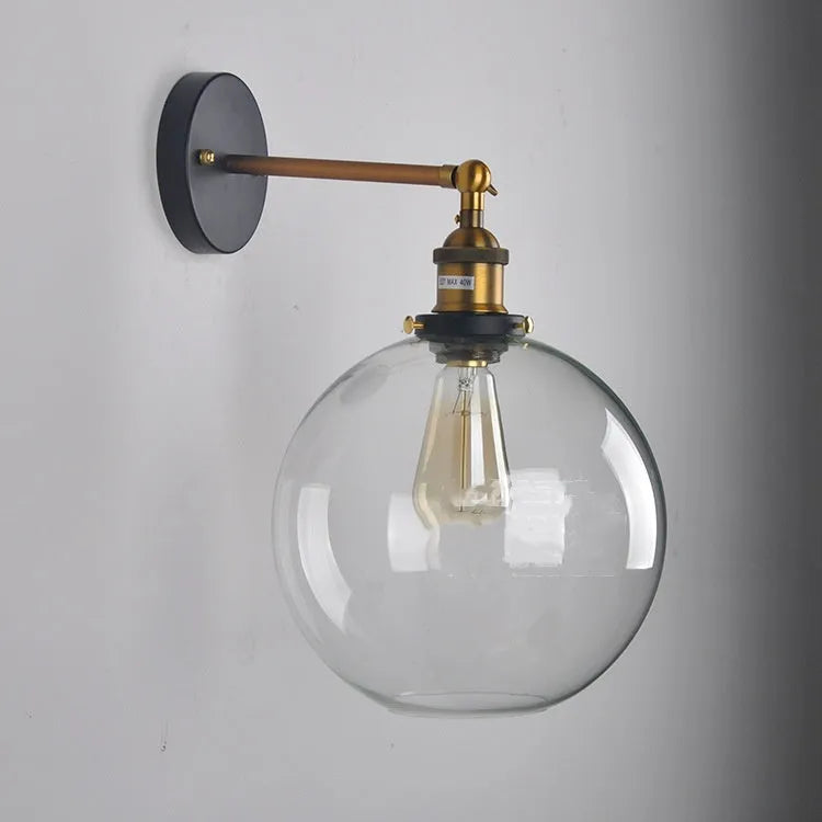 Retro spherical glass wall light fitting with a 20cm diameter, shown in amber tint.
