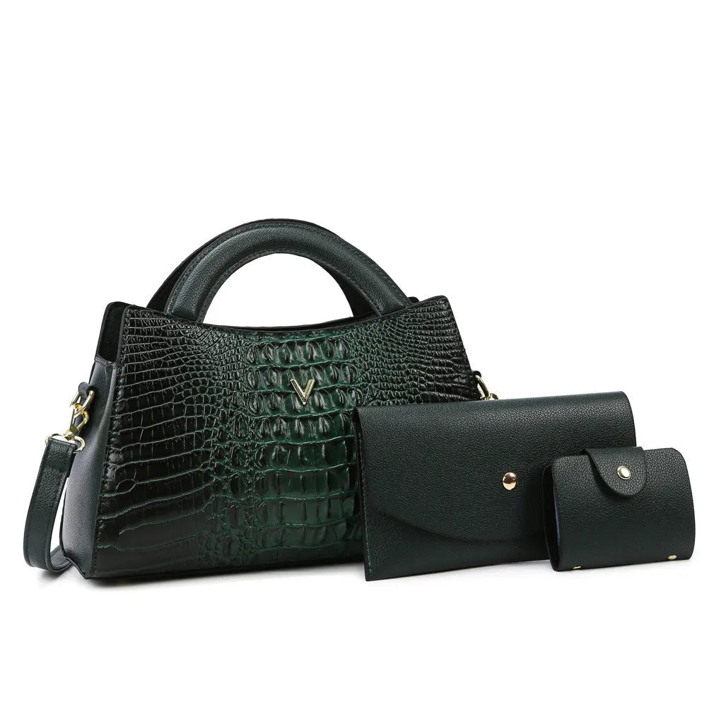 Women's square black crocodile pattern crossbody handbag with visible stitching and a single shoulder strap.