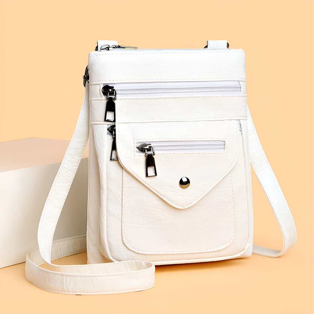 Vertical square crossbody phone bag in pu leather with sewing line detail and crossbody strap