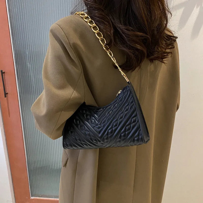 Brown pleated chain shoulder bag with square shape and adjustable metal strap