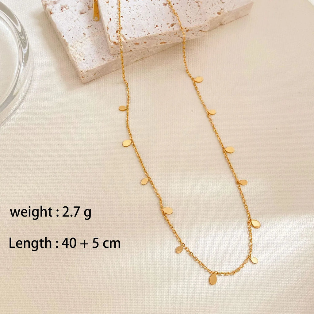 Gold electroplated titanium steel geometric pendant necklace for women in round slice, square, or water drop shape