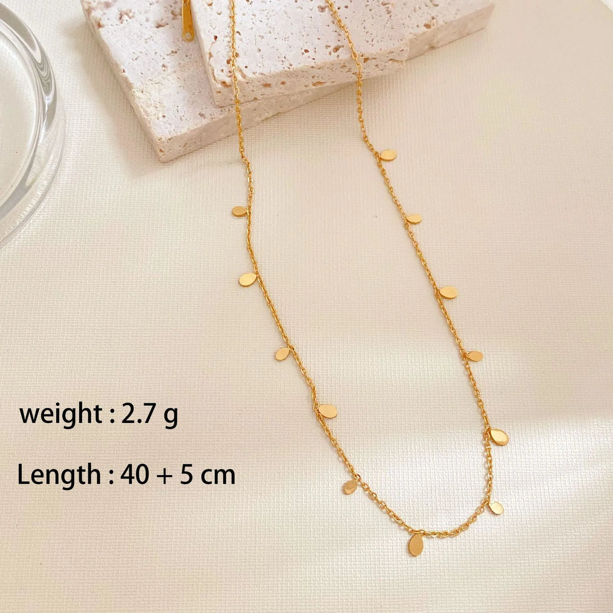 Gold electroplated titanium steel geometric pendant necklace for women in round slice, square, or water drop shape