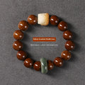Hand-woven Buddhist prayer bracelet with 13mm round beads in ivory nut, bodhi, or sandalwood lion style