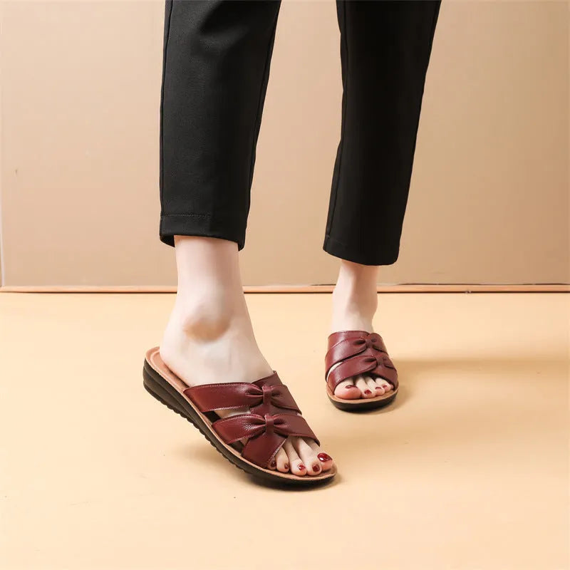 Solid colour cowhide slippers for women with soft non-slip soles in beige, black, and red options