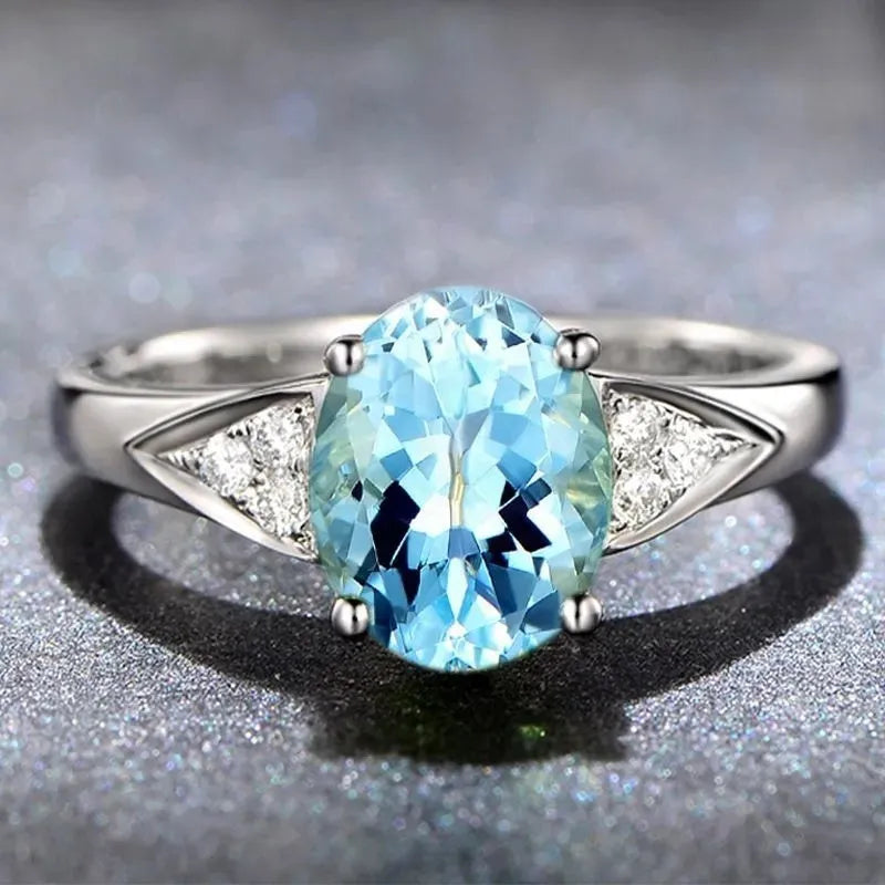 Ladies court style ring with a natural zircon heart-shaped inlay in a red colour option.
