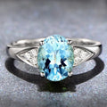 Women's court ring with blue natural zircon stones in a heart pattern.