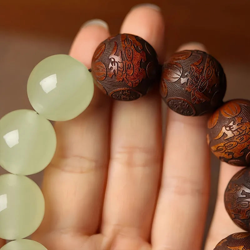 Wooden bracelet with carved Amass Fortunes character on rosewood segments