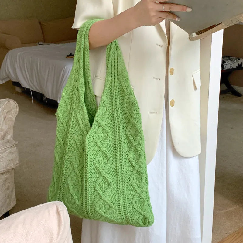 Retro hollow-knitted polyester shoulder tote bag in grass green, showing double straps and textured crochet design.