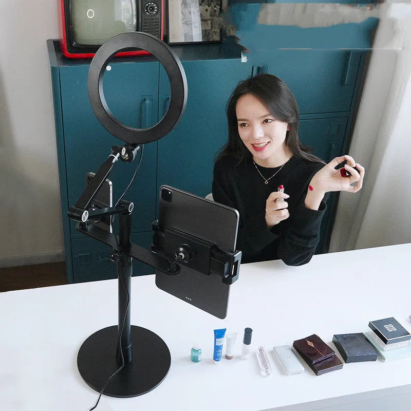 Black aluminium alloy floor standing mobile tablet holder with integrated LED fill light in folded position